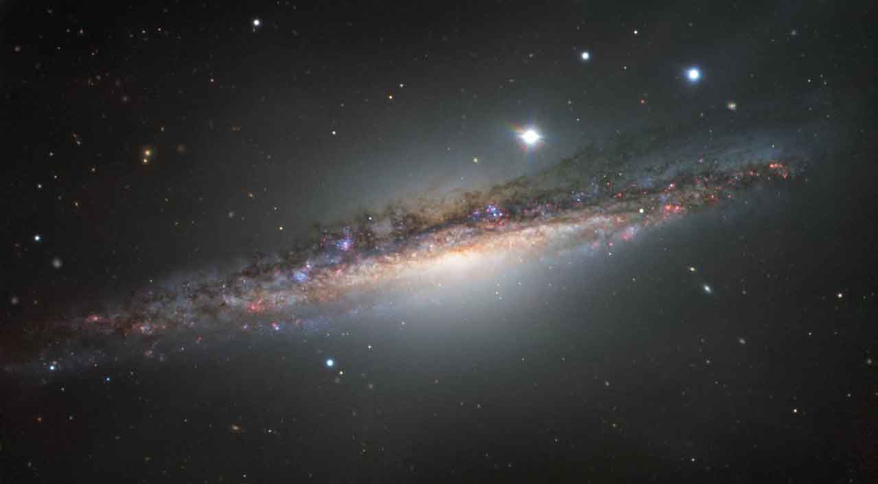 Çok uzaklardaki gizemli diyar: NGC 1055